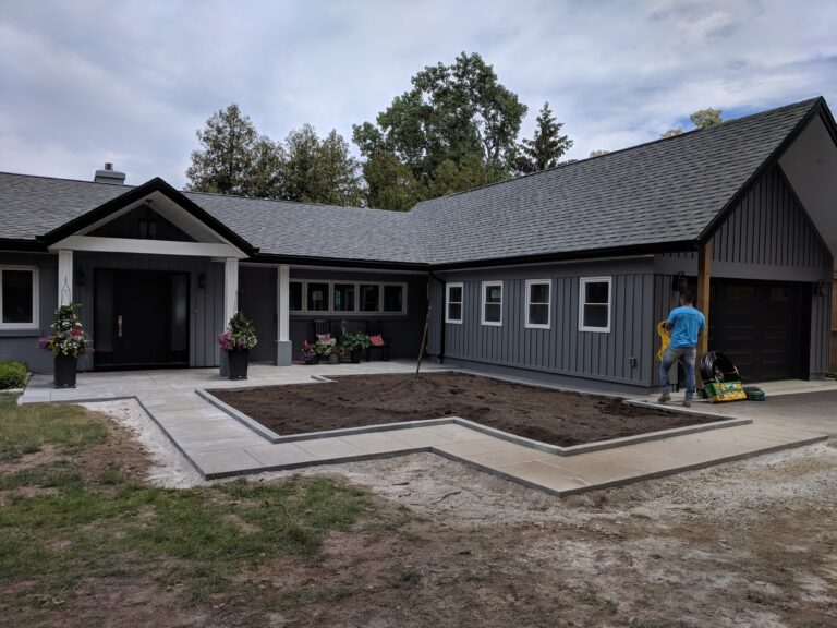 Paving stone front walkway with English garden in Meaford by EcoCultures