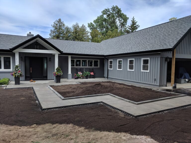 Paving stone front walkway with English garden in Meaford by EcoCultures