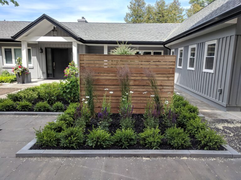 Paving stone front walkway with English garden in Meaford by EcoCultures