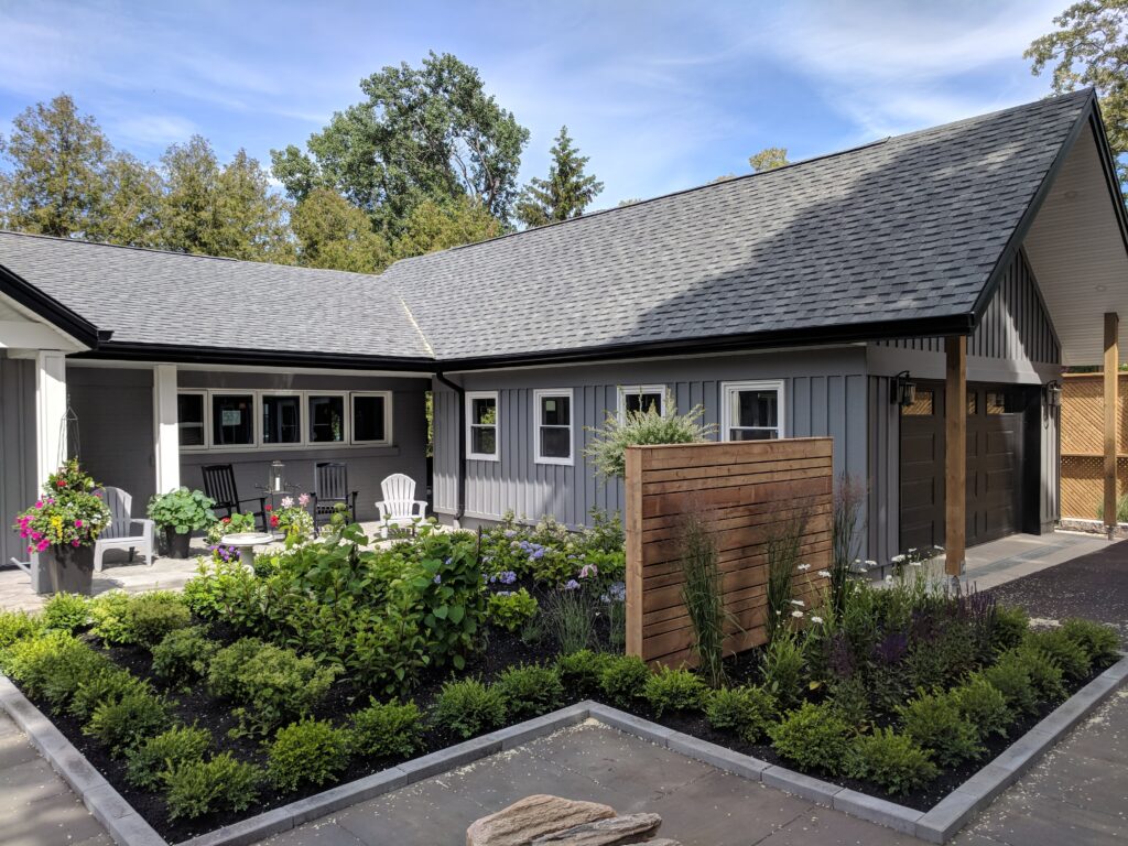 Paving stone front walkway with English garden in Meaford by EcoCultures
