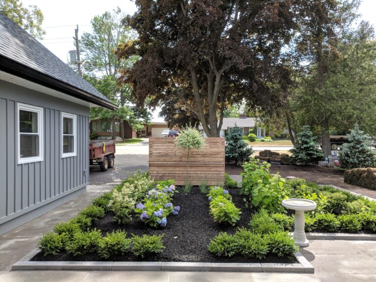 Paving stone front walkway with English garden in Meaford by EcoCultures