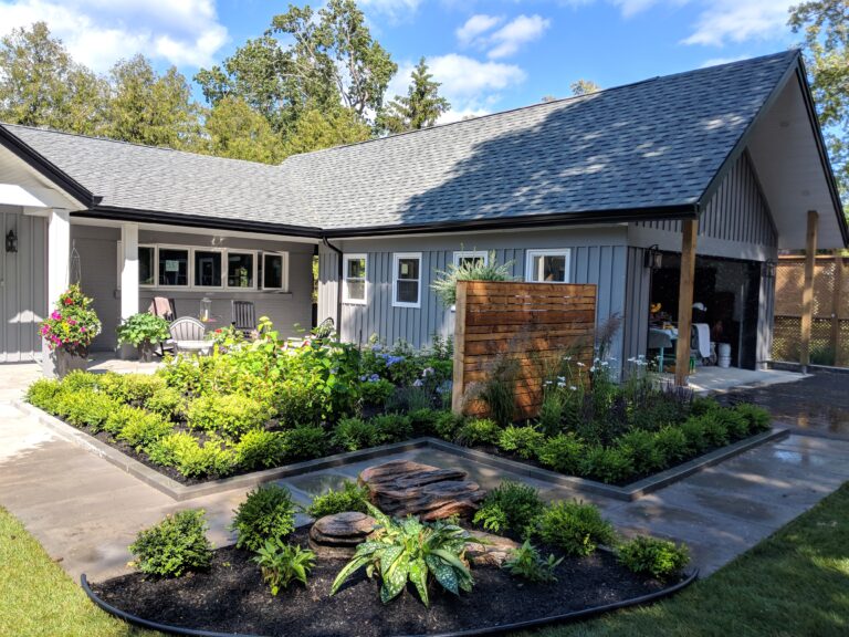 Paving stone front walkway with English garden in Meaford by EcoCultures