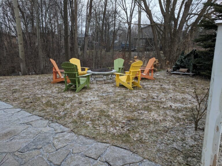 Flagstone patio with fire pit, retaining wall, and native gardens in Blue Mountains by EcoCultures