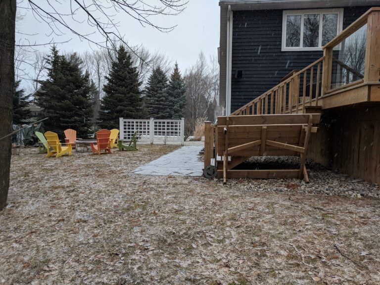 Flagstone patio with fire pit, retaining wall, and native gardens in Blue Mountains by EcoCultures