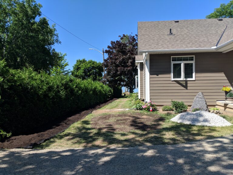 Stepping stone walkway with patio and attractant garden in Meaford by EcoCultures